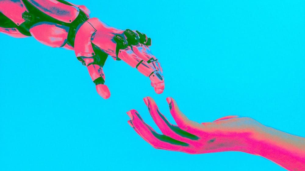 Robot hand and human hand reaching toward each other, showing AI and developers working together