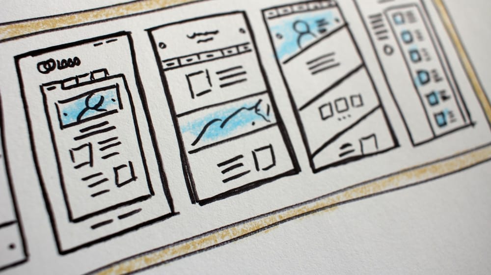 Hand-drawn wireframe cards of page layouts, planning which Shopify sections a theme needs