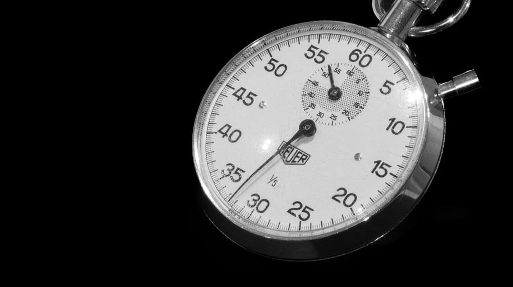 Close-up of a stopwatch on black, timing how quickly a page responds to taps