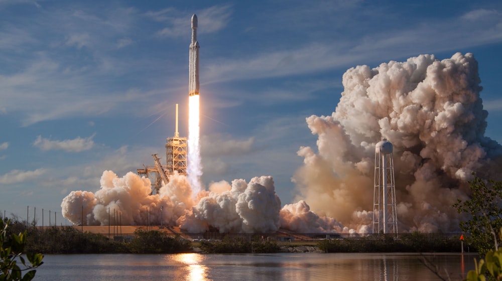 Rocket lifting off at dawn
